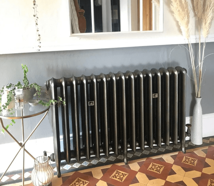 A Milano cast iron radiator in a modern hallway space