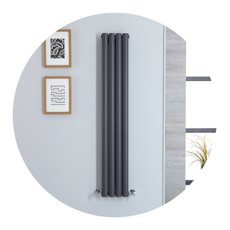 Tall grey Milano Aruba slim designer radiator on a grey wall