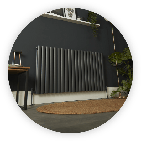Anthracite Milano Aruba Ayre aluminium designer radiator against a dark wall