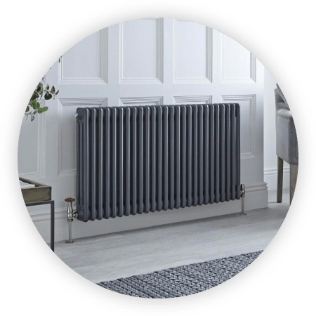 White electric Milano Aruba designer radiator on a grey wall