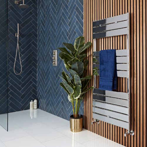 Chrome designer heated towel rail in a modern wetroom