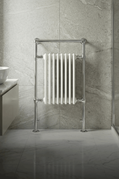 Heated bathroom space with a radiator suited to humid environments